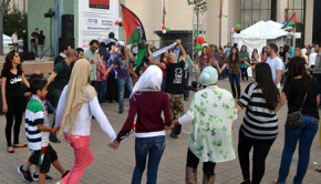 Festival patrons engaged in traditional Palestinian style dance. One of the goals of the festival was to break the negative stereotypes of Palestinians and Palestinian culture. | Aisha Bouderbaden/The Daily Cougar