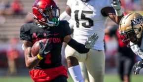 UH receiver Nathaniel Dell looks for the UCF defender and prepares to attempt a stiff arm to avoid being tackled. The game took place at TDECU Stadium during the 2020 season. | Courtesy of UH athletics
