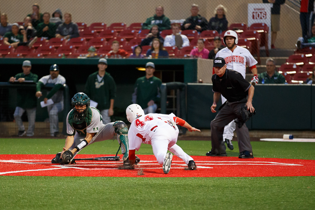 Freshman infielder Connor Hollis almost scores on a close play at the plate. | Justin Tijerina/The Daily Cougar