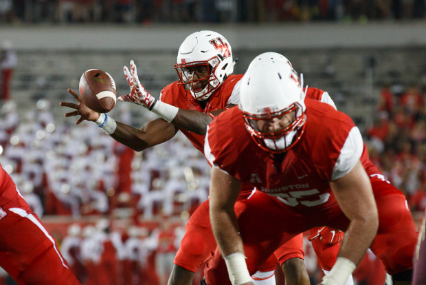 Junior quarterback Greg Ward, Jr., center, had a career night en route to the UH victory, as he complied six total touchdowns on the night. | Justin Tijerina/The Cougar