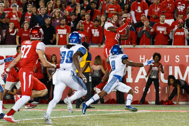 Junior receiver Demarcus Ayers, right, hauled in 13 catches on the night for 127 yards receiving. | Justin Tijerina/The Cougar