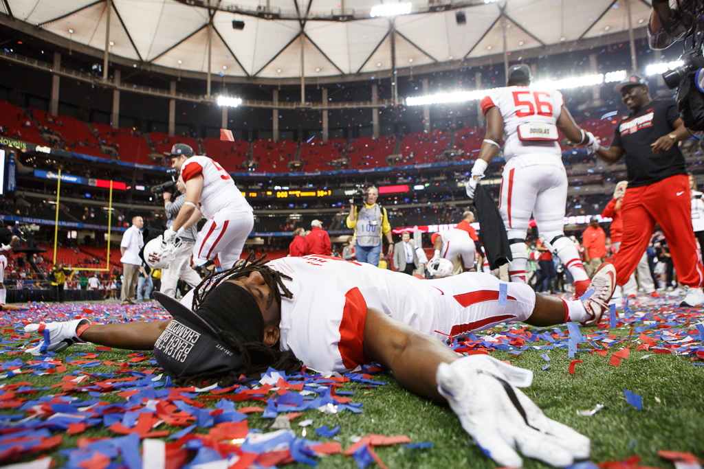 Senior safety Trevon Stewart makes confetti angels after the game. | Justin Tijerina/The Cougar