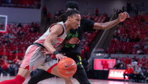 UH men's basketball guard Caleb Mills drives through the lane with a USF defender right on his side. He was the scoring leader for Houston in 2019-20 averaging 13.2 points per contest. | Kathyrn Lenihan/The Cougar