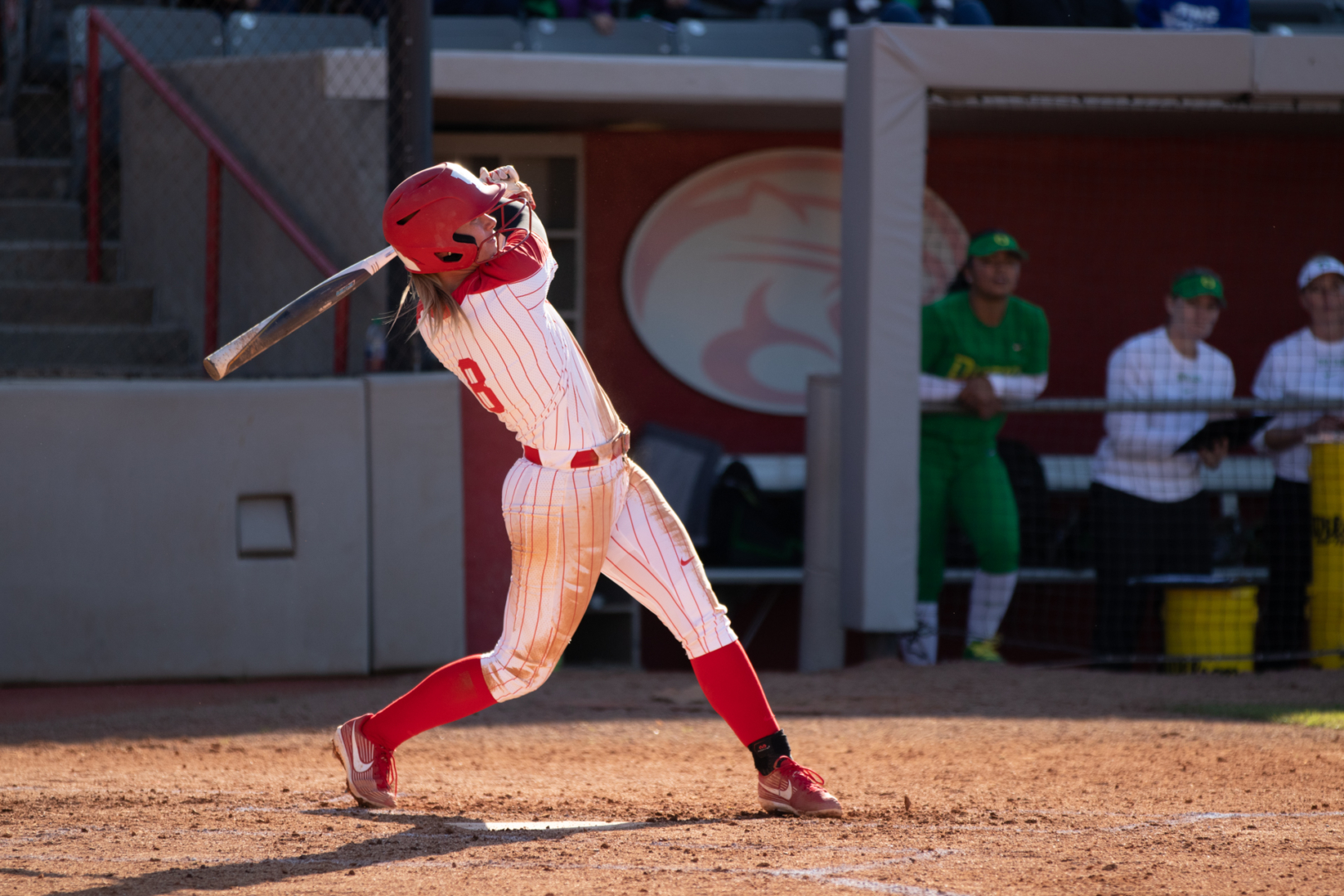 Senior infielder Sarah Queen holding her form after swinging at a pitch against Oregon on Friday afternoon. The Cougars shut down the Flyers 7-0, but they fell to the Ducks 4-2 in the second game of the day. | Kathryn Lenihan/The Cougar