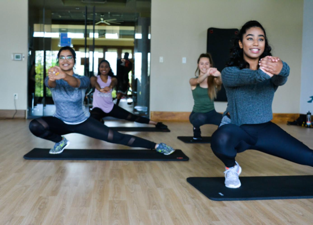 Vismita Varghese (left) teaches yoga at her family-run studio Bollycurves in Missouri City. | Courtesy of Vismita Varghese