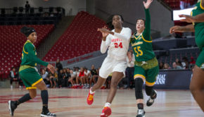 Houston forward Maya Jones slashing through the paint while being hounded by a Southeastern Louisiana defender during the 2019-20 season at Fertitta Center. | Trevor Nolley/The Cougar