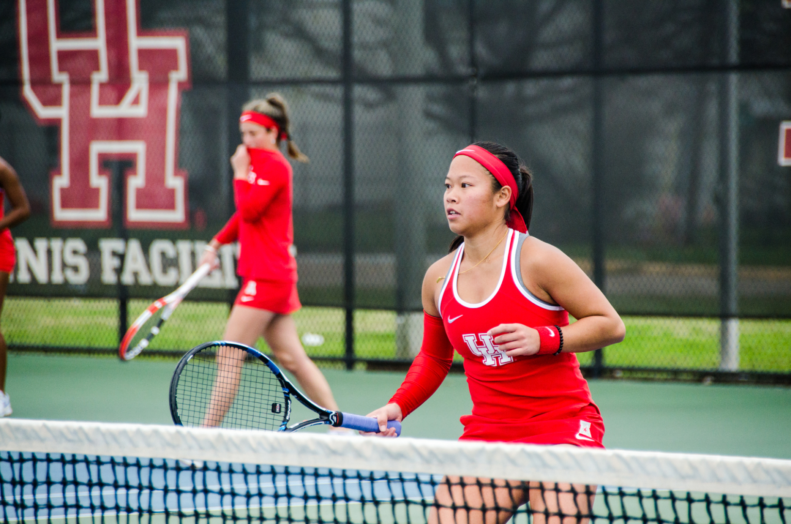 UH tennis senior Phonexay Chitdara (right) was a part of the duo that defeated Texas A&M and its ranked duo in a match on Monday. | Lino Sandil/The Cougar