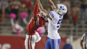 BYU junior receiver Dax Milne skies over UH junior cornerback Shaun Lewis. Milne then raced to the end zone for the 78-yard score. | Courtesy of UH athletics