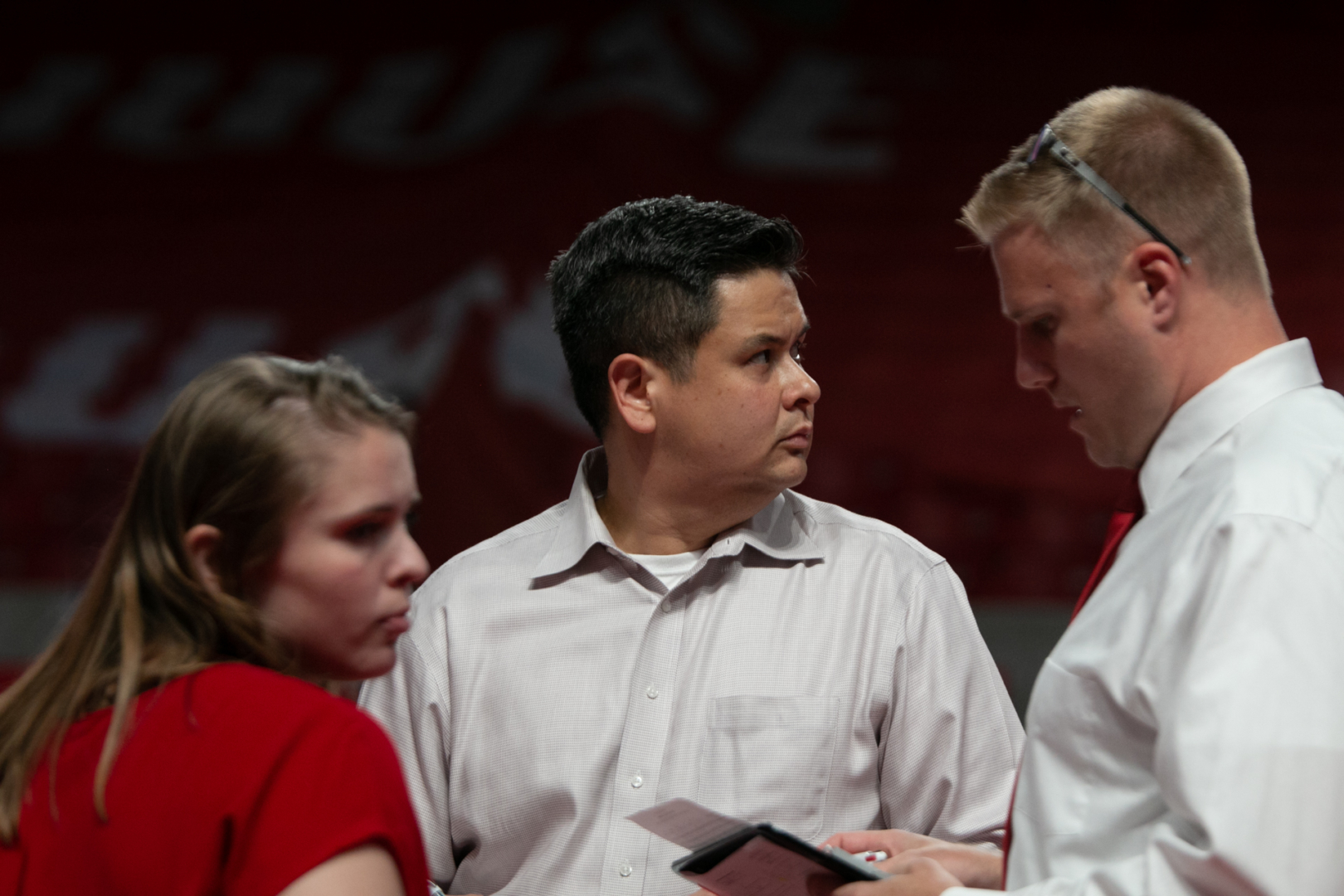 UH volleyball head coach David Rehr huddles up with his coaching staff during a game in the Flo Hyman Collegiate Cup at Fertitta Center during the 2019 season. | Kathryn Lenihan/The Cougar