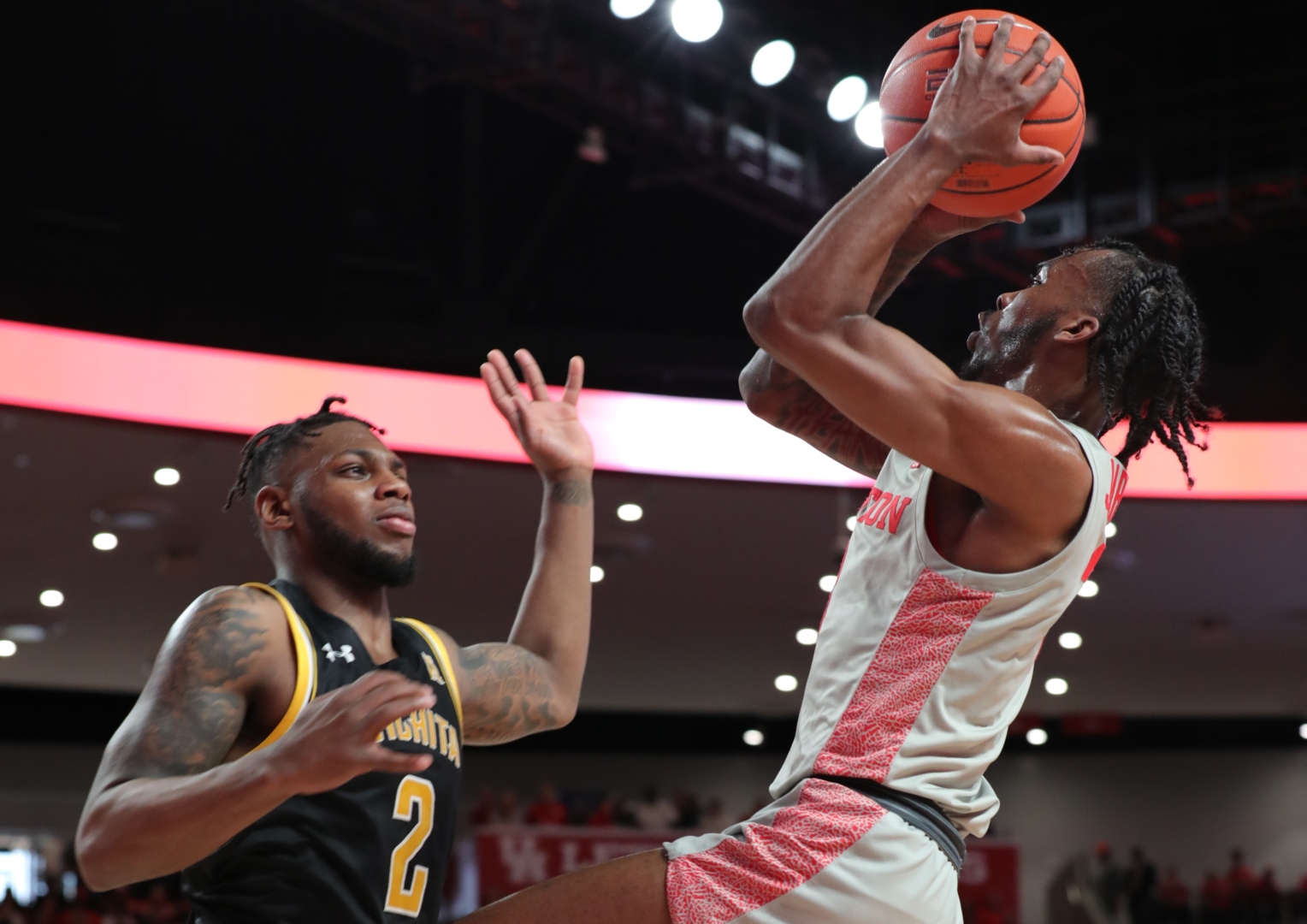 UH guard DeJon Jarreau challenges Wichita State guard Jamarius Burton during a 2019-20 season game at Fertitta Center. Kelvin Sampson and his Cougars suffered their first loss of 2020-21 against Tulsa on Tuesday. | Mikol Kindle Jr./The Cougar