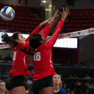UH volleyball middle blockers Rachel Tullos (11) and Kendall Haywood (16) bump into each other near the net in a game against Texas A&M Corpus Christi on Aug. 30, 2019 inside of the Fertitta Center. UH volleyball began its 2020-21 season on Saturday against Rice. | Kathryn Lenihan/The Cougar