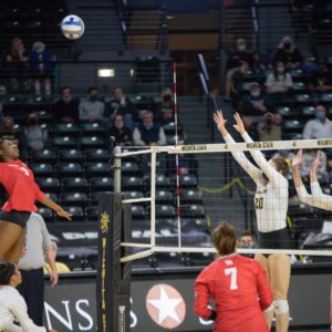 UH junior outside hitter Kortlyn Henderson skies up to spike the volleyball on Friday night in a match against Wichita State. | Sean Marty/The Sunflower