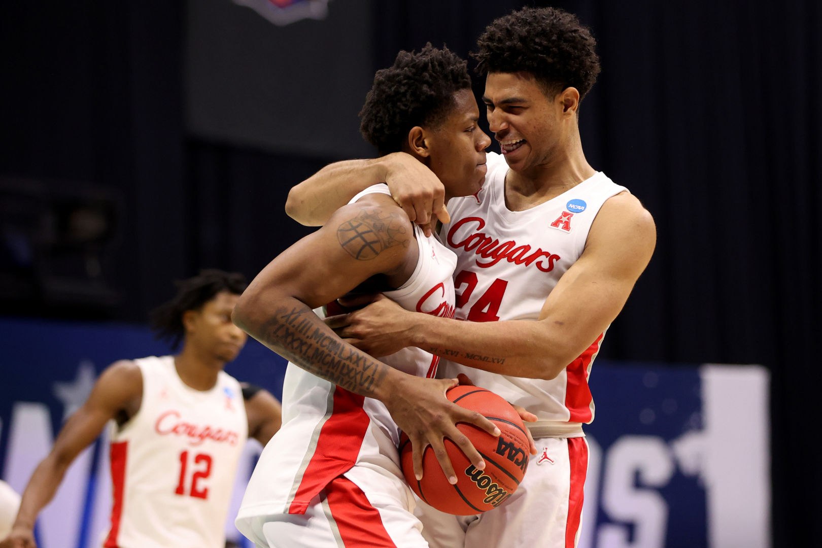 INDIANAPOLIS, IN - MARCH 21: Marcus Sasser #0 and Quentin Grimes #24 of the UH Cougars celebrate their victory over the Rutgers Scarlet Knights in the second round of the 2021 NCAA Division I Men’s Basketball Tournament held at Lucas Oil Stadium on March 21, 2021 in Indianapolis, Indiana. (Photo by Jamie Schwaberow/NCAA Photos via Getty Images)