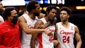 UH upperclassmen Justin Gorham (left) and Quentin Grimes (right) celebrate around freshman Tramon Mark (middle) after the Cougars' last-minute comeback win over Rutgers in the round of 32 in the NCAA Tournament at Lucas Oil Stadium on March 21, 2021 in Indianapolis, Indiana. | Photo by Jamie Schwaberow/NCAA Photos via Getty Images