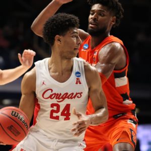 Quentin Grimes (24) of the Houston Cougars looks to pass the ball around Quincy Guerrier (1) of the Syracuse Orange in the Sweet Sixteen round of the 2021 NCAA Division I Men's Basketball Tournament held at Hinkle Fieldhouse on March 27, 2021 in Indianapolis, Indiana. UH will now play Oregon State on Monday in the Elite Eight. | Photo by Trevor Brown Jr/NCAA Photos via Getty Images