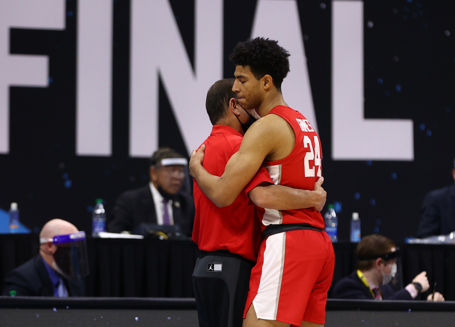 UH head coach Kelvin Sampson embraces Quentin Grimes (24) of the Cougars after a loss to the Baylor Bears in the Final Four semifinal game of the 2021 NCAA Men's Basketball Tournament at Lucas Oil Stadium on April 03, 2021 in Indianapolis, Indiana. Kelvin Sampson thanked his players for their commitment for the season after the game. | Photo by Jamie Schwaberow/NCAA Photos via Getty Images