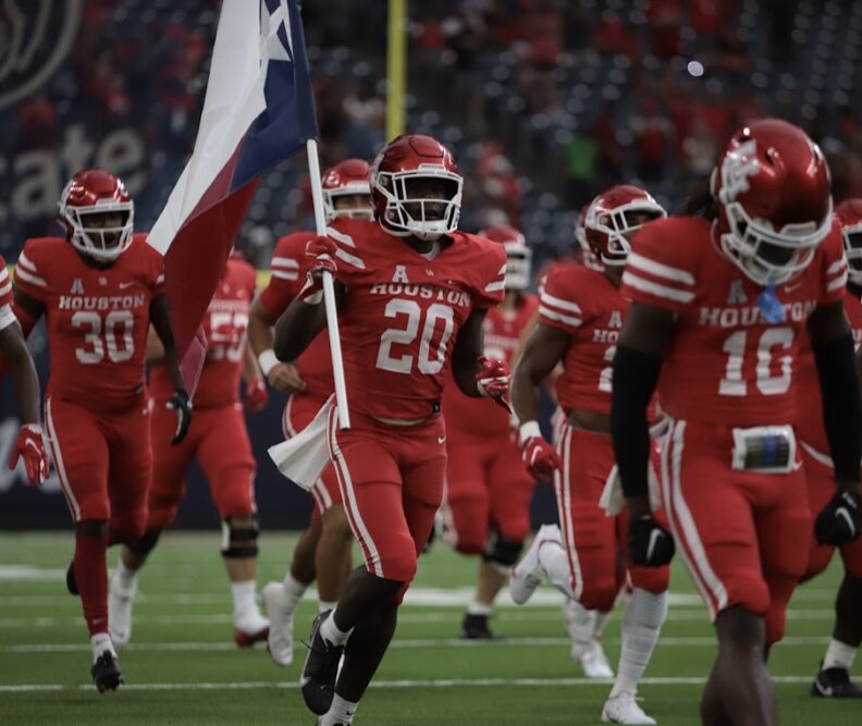 The UH football team takes the field at NRG Stadium before its 2021 season-opener against Texas Tech. | James Schillinger/The Cougar
