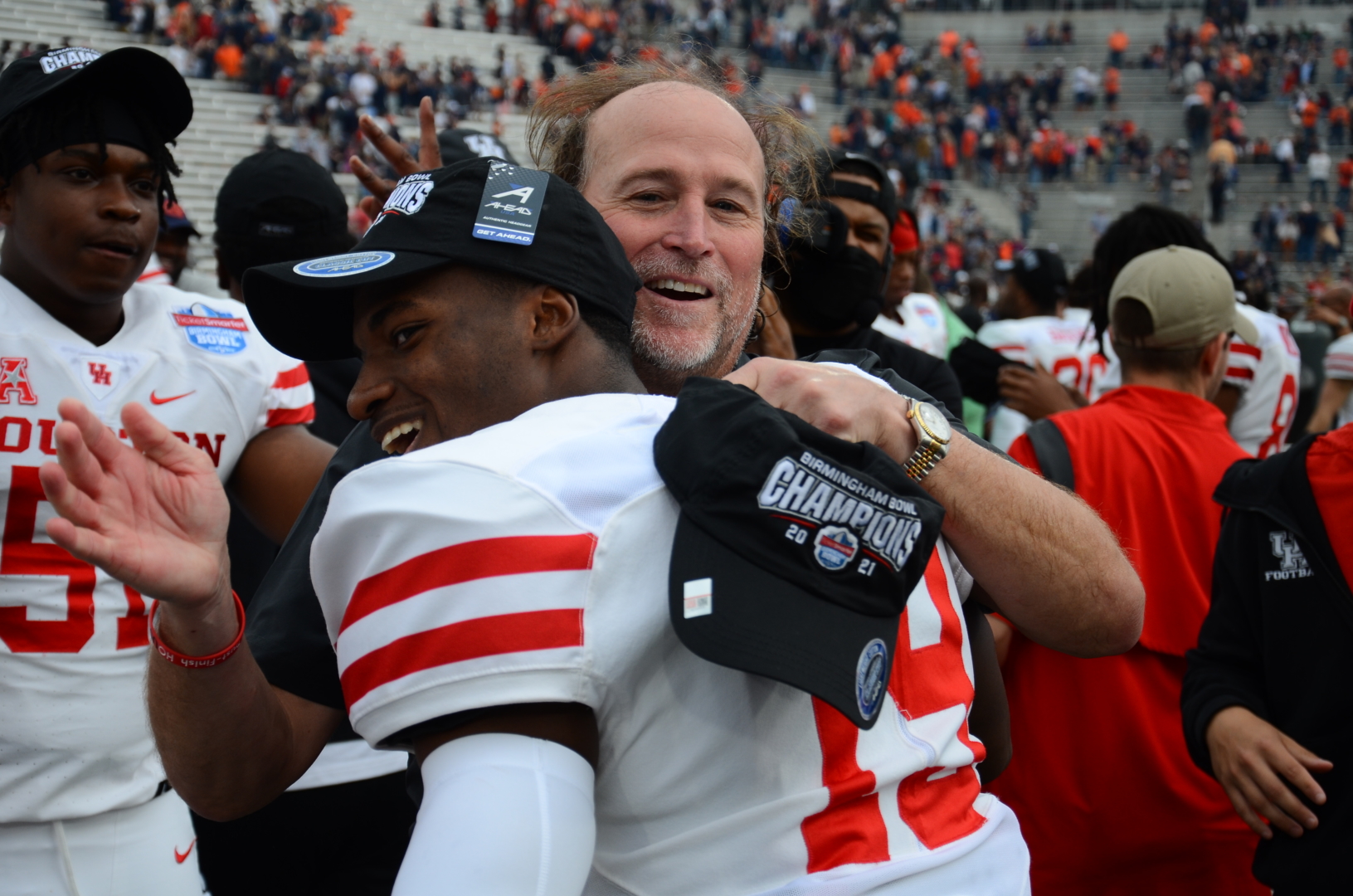 Dana Holgorsen embraced his players with lots of smiles and hugs to celebrate UH football's Birmingham Bowl victory over Auburn on Tuesday. | Steven Paultanis/The Cougar