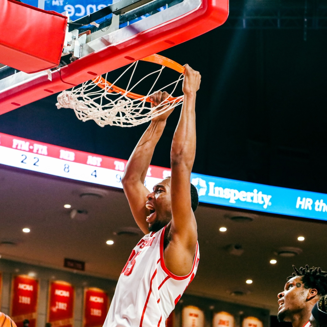Graduate forward Fabian White Jr. throws down a two handed slam in the Cougars win over Louisiana. | Victor Carroll/The Cougar