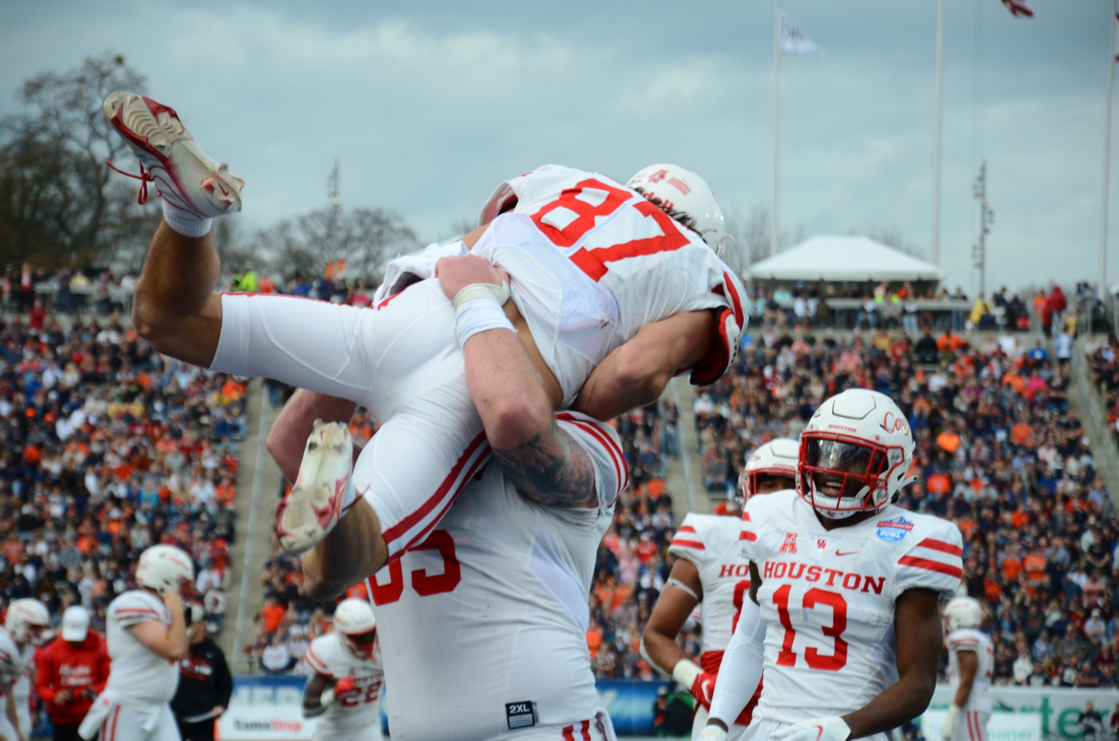 UH center Kody Russey lifts Jake Herslow into the air after what ended up being the game-winning touchdown in the Birmingham Bowl. | Steven Paultanis/The Cougar