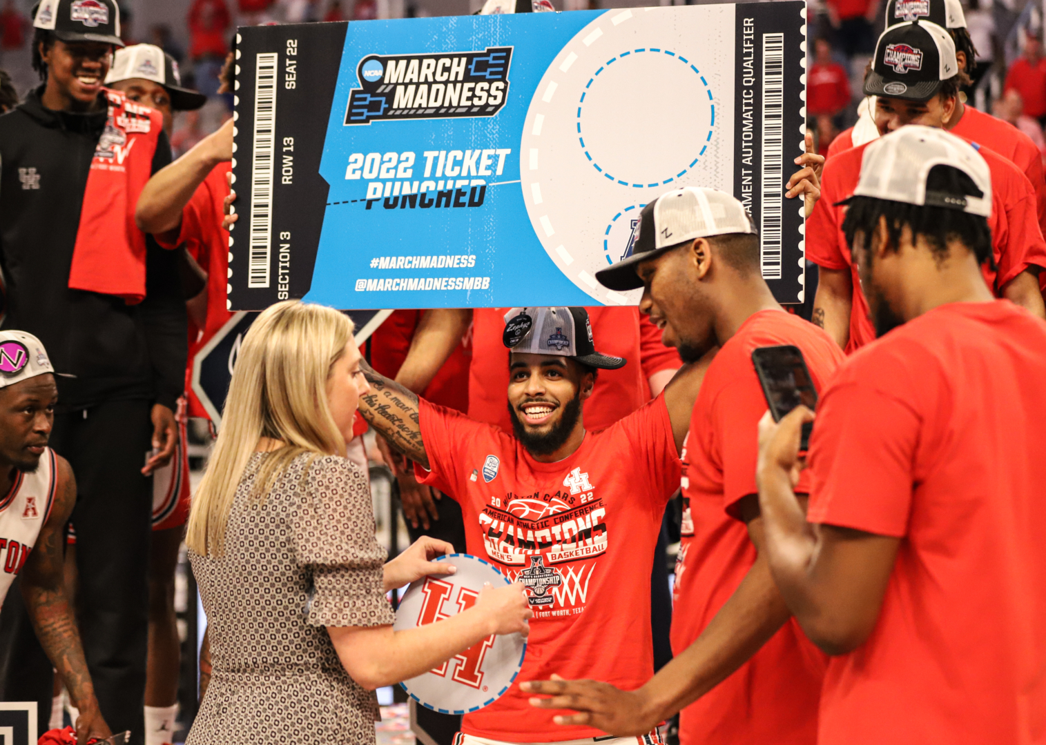 UH guard Kyler Edwards holds the ticket the Cougars punched to the Big Dance after defeating Memphis to win the American Athletic Conference tournament in Fort Worth. | Sean Thomas/The Cougar