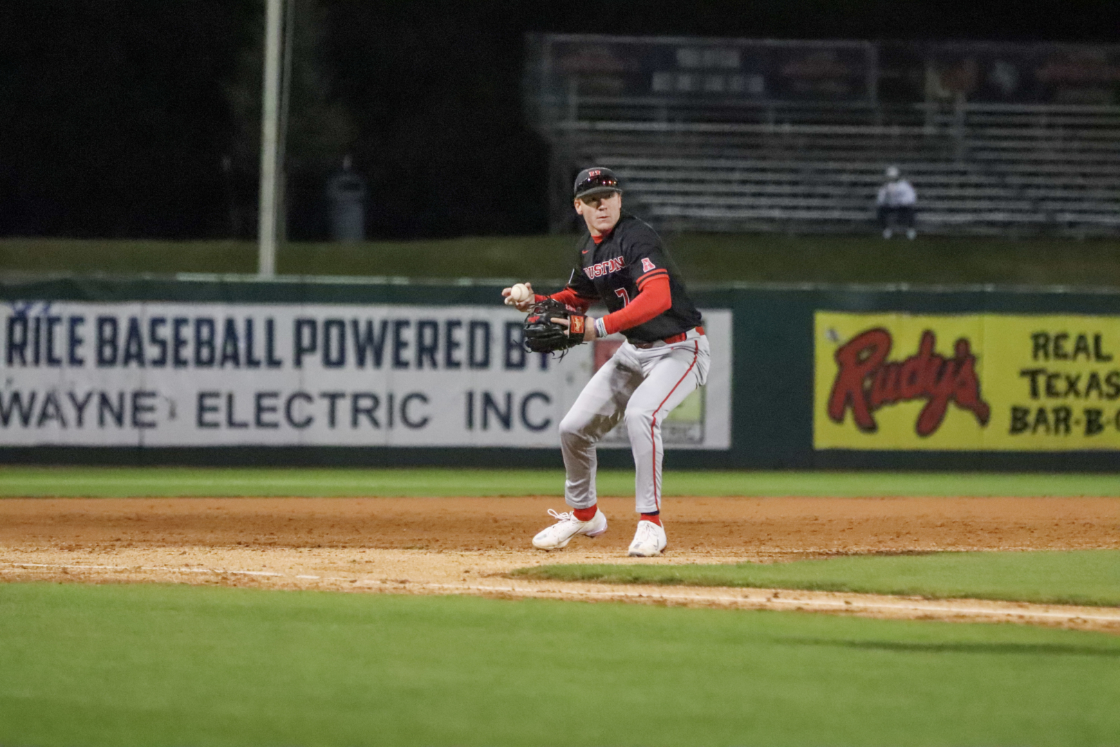 Sophomore third baseman Zach Arnold guns down a runner at home in the third inning of UH baseball's win over Rice on Tuesday night at Reckling Park. | James Mueller/The Cougar