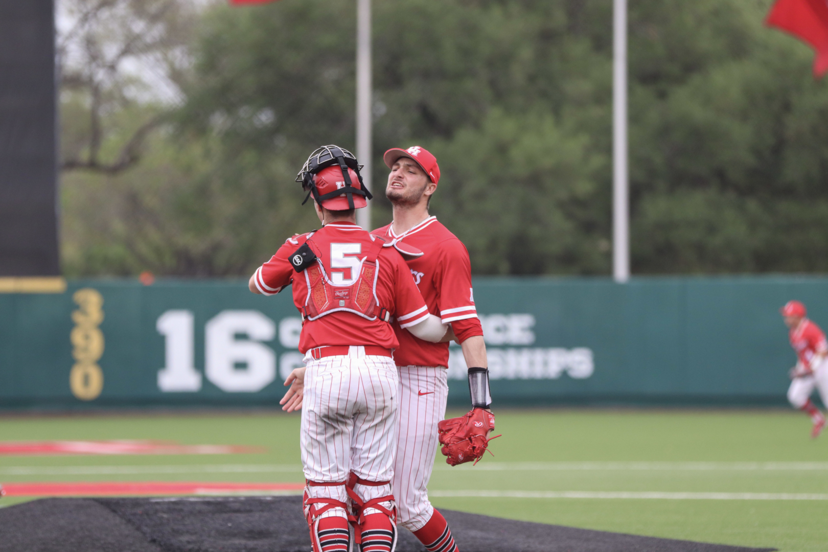 Ben Sears gives UH baseball catcher Anthony Tulimero a chest bump after securing the series victory over Tulane, the AAC's first place team. | James Mueller/The Cougar
