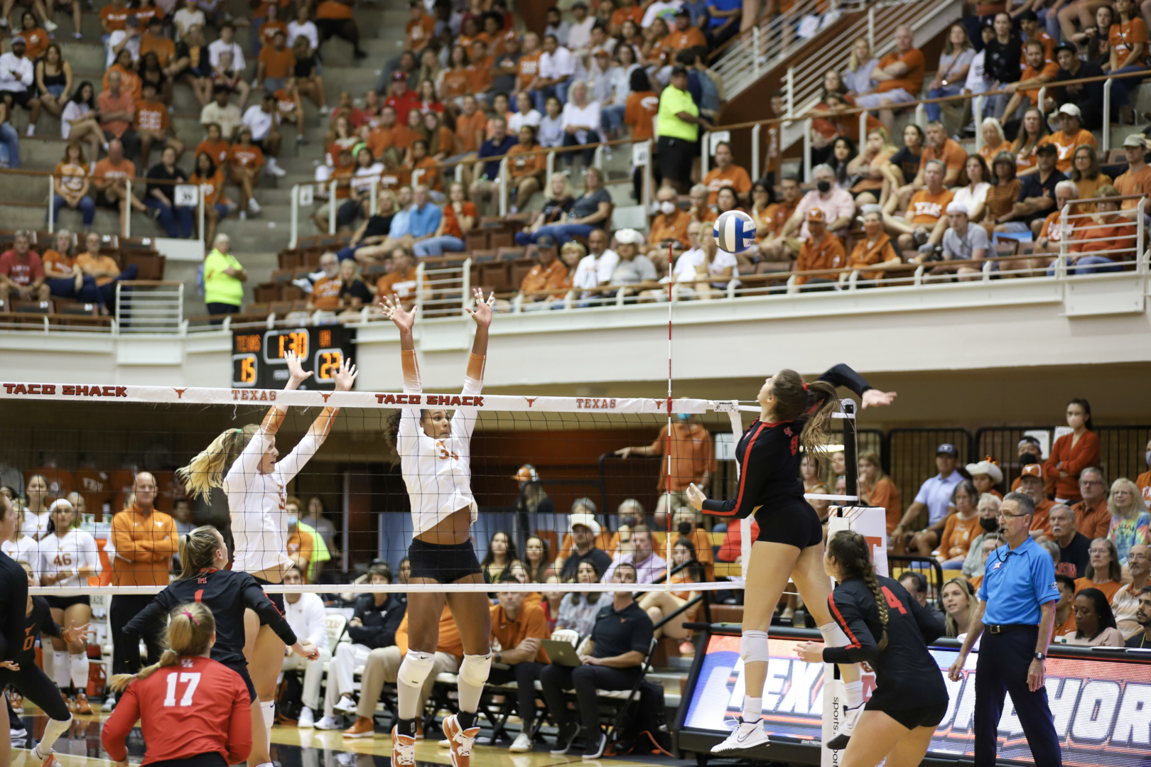 UH volleyball graduate middle blocker Isabel Theut goes for the kill in the first set of the Cougars' match against Texas on Thursday night in Austin. | James Mueller/The Cougar
