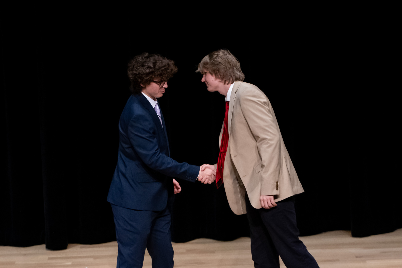 SGA presidential candidates shake hands at the first debate of the election season